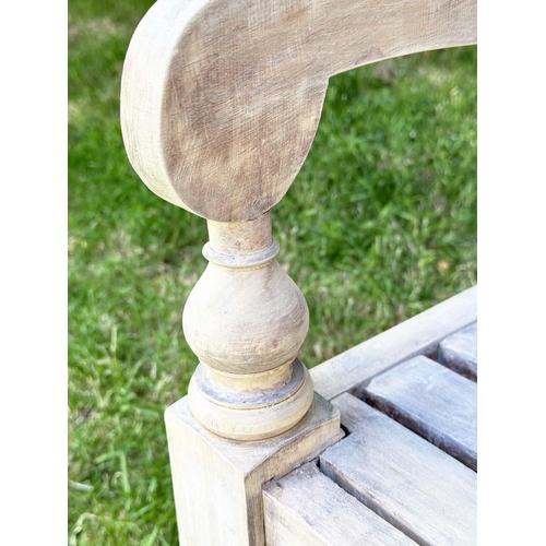 127 - COLONIAL STYLE GARDEN BENCH, weathered teak with inset twin panelled back downswept scroll arms and ... 