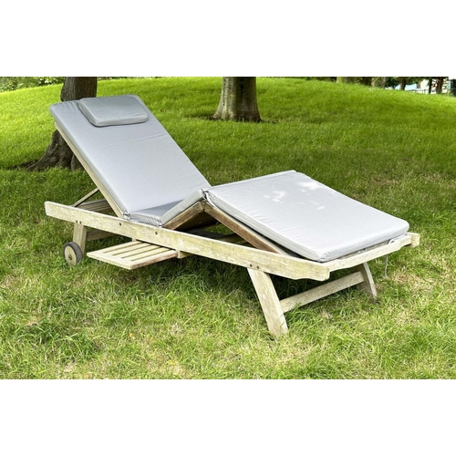 133 - GARDEN LOUNGER BY LINDSEY, nicely weathered teak multi folding slatted with wheels, drinks tray and ... 