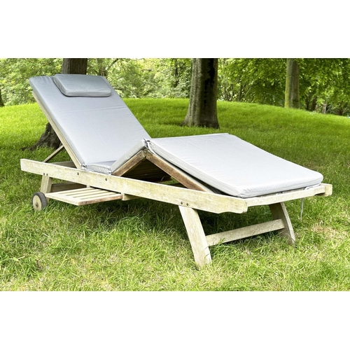 133 - GARDEN LOUNGER BY LINDSEY, nicely weathered teak multi folding slatted with wheels, drinks tray and ... 