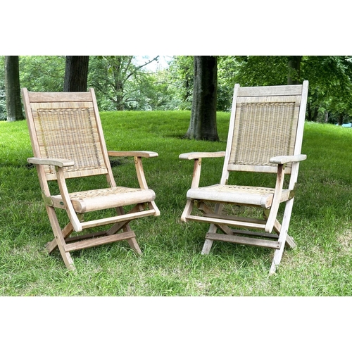 136 - 'WESTMINSTER' GARDEN/CONSERVATORY TERRACE FOLDING ARMCHAIRS, a pair, teak and brass hinged with cane... 