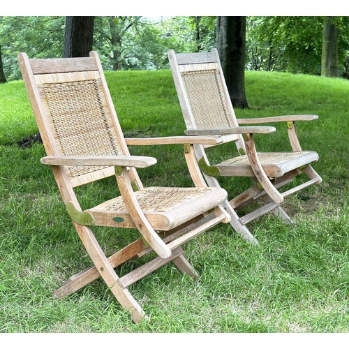 136 - 'WESTMINSTER' GARDEN/CONSERVATORY TERRACE FOLDING ARMCHAIRS, a pair, teak and brass hinged with cane... 