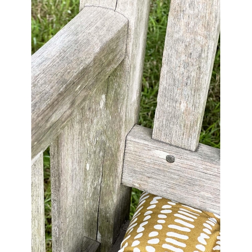 137 - GARDEN BENCH, vintage 'Lister' weathered teak with drop arms and cross slatted seat, 136cm W.