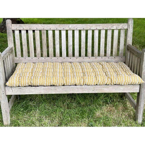 137 - GARDEN BENCH, vintage 'Lister' weathered teak with drop arms and cross slatted seat, 136cm W.