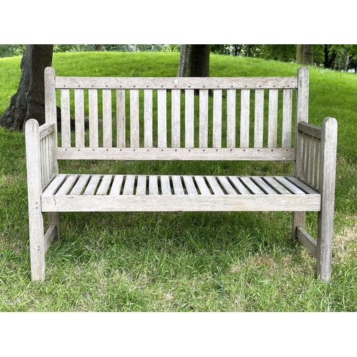 137 - GARDEN BENCH, vintage 'Lister' weathered teak with drop arms and cross slatted seat, 136cm W.