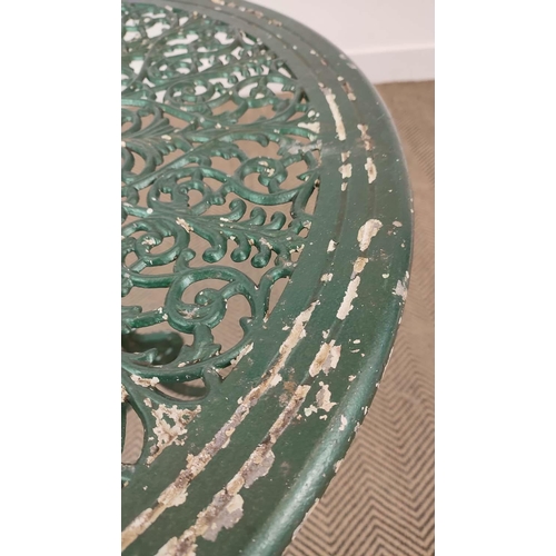 147 - GARDEN TABLE, circular green painted metal, 65cm H x 69cm D, and a set of three chairs, 85cm H x 41c... 