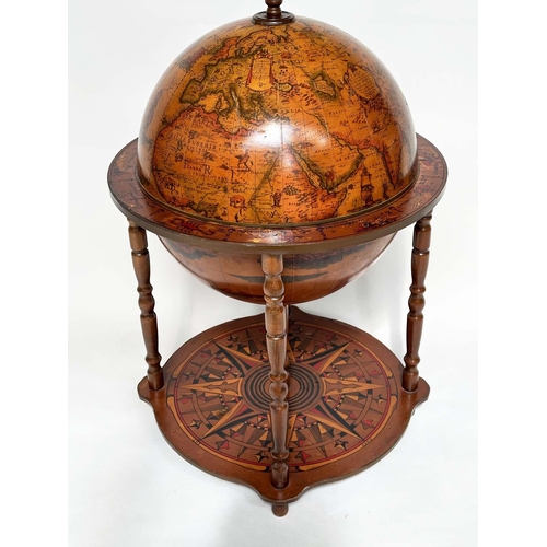 297 - GLOBE COCKTAIL CABINET, in the form of an antique terrestrial globe on stand with rising lid and fol... 