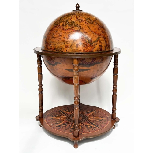 297 - GLOBE COCKTAIL CABINET, in the form of an antique terrestrial globe on stand with rising lid and fol... 