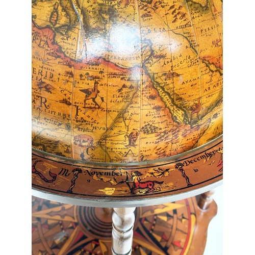 297 - GLOBE COCKTAIL CABINET, in the form of an antique terrestrial globe on stand with rising lid and fol... 