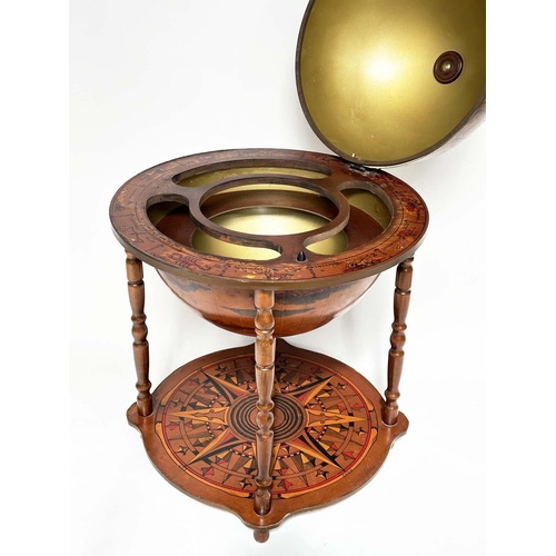 297 - GLOBE COCKTAIL CABINET, in the form of an antique terrestrial globe on stand with rising lid and fol... 