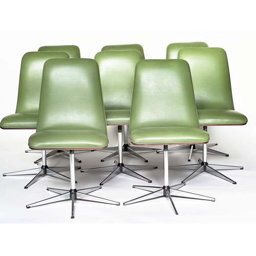 299 - ROBERT HERITAGE CHAIRS, a set of eight, green piped upholstered with veneered curved backs revolving... 