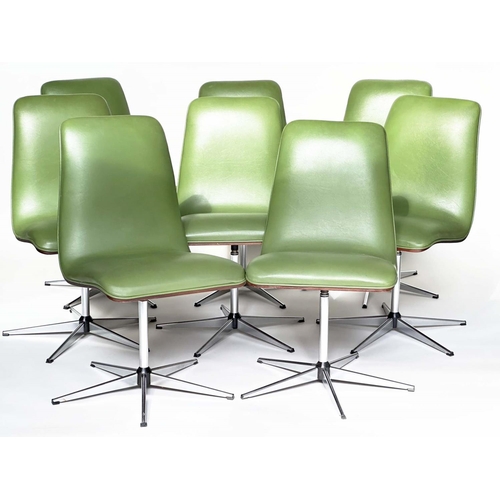 299 - ROBERT HERITAGE CHAIRS, a set of eight, green piped upholstered with veneered curved backs revolving... 