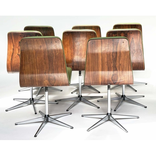 299 - ROBERT HERITAGE CHAIRS, a set of eight, green piped upholstered with veneered curved backs revolving... 