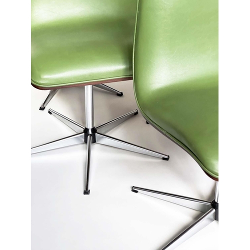 299 - ROBERT HERITAGE CHAIRS, a set of eight, green piped upholstered with veneered curved backs revolving... 