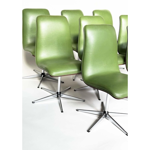 299 - ROBERT HERITAGE CHAIRS, a set of eight, green piped upholstered with veneered curved backs revolving... 