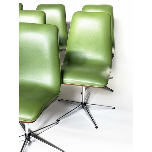 299 - ROBERT HERITAGE CHAIRS, a set of eight, green piped upholstered with veneered curved backs revolving... 