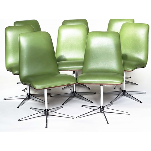 299 - ROBERT HERITAGE CHAIRS, a set of eight, green piped upholstered with veneered curved backs revolving... 