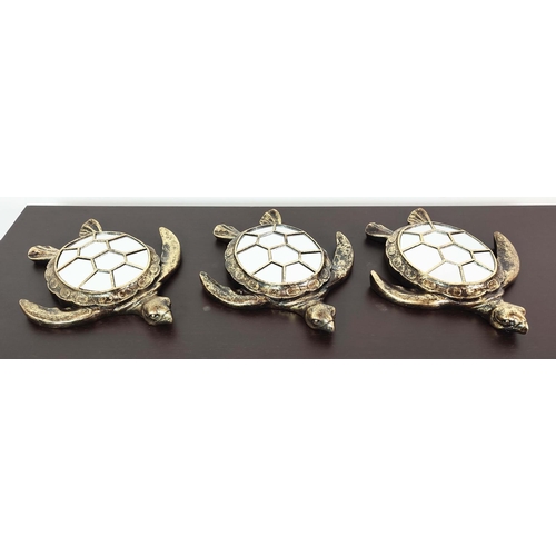 374 - TURTLE WALL MIRRORS, a set of three, gilt finish with segmented mirrored plates, 38cm x 33cm approx.... 