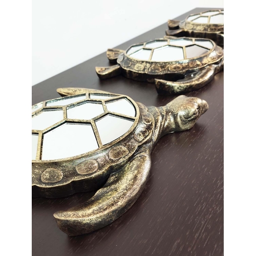 374 - TURTLE WALL MIRRORS, a set of three, gilt finish with segmented mirrored plates, 38cm x 33cm approx.... 