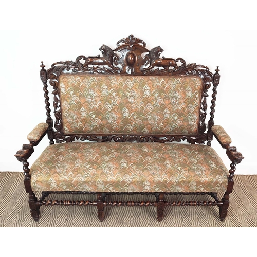 91 - SETTEE, early 20th century Jacobean style oak, with lion carved frame and patterned upholstery, 141c... 