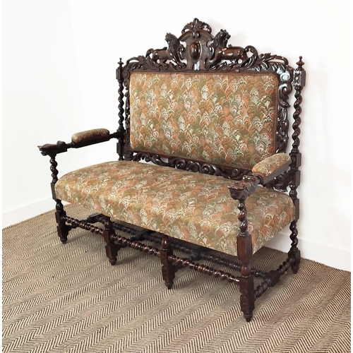 91 - SETTEE, early 20th century Jacobean style oak, with lion carved frame and patterned upholstery, 141c... 