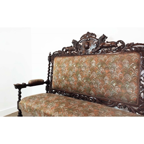 91 - SETTEE, early 20th century Jacobean style oak, with lion carved frame and patterned upholstery, 141c... 