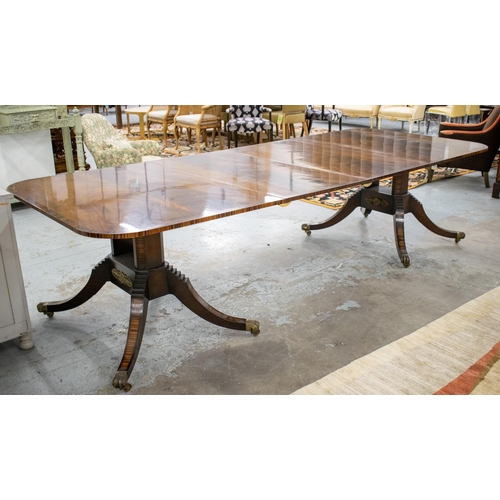 165 - TWIN PEDESTAL DINING TABLE, Regency style mahogany, coromandel and brass mounted with two extra leav... 