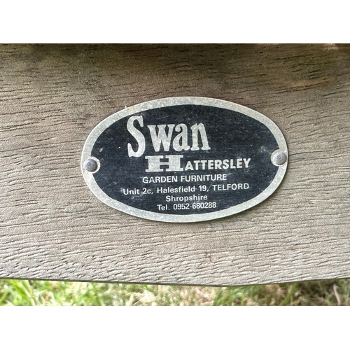 131 - SWAN HATTERSLEY GARDEN BENCH, weathered slatted teak with arched back and flat top shaped arms, 161c... 