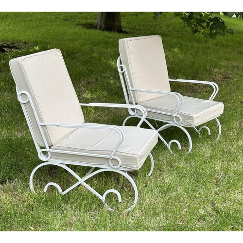 132 - GARDEN TERRACE ARMCHAIRS, a pair, vintage white painted box section metal with cushions on scroll su... 