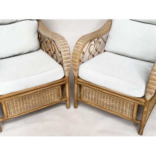 138 - CONSERVATORY ARMCHAIRS, a pair, sun bleached rattan framed wicker panelled and cane bound with round... 