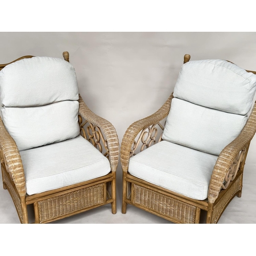 138 - CONSERVATORY ARMCHAIRS, a pair, sun bleached rattan framed wicker panelled and cane bound with round... 