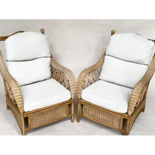 138 - CONSERVATORY ARMCHAIRS, a pair, sun bleached rattan framed wicker panelled and cane bound with round... 