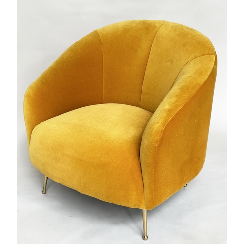 298 - HEAL'S ARMCHAIR, yellow velvet upholstered with curved back and tapering gilt metal supports, labell... 