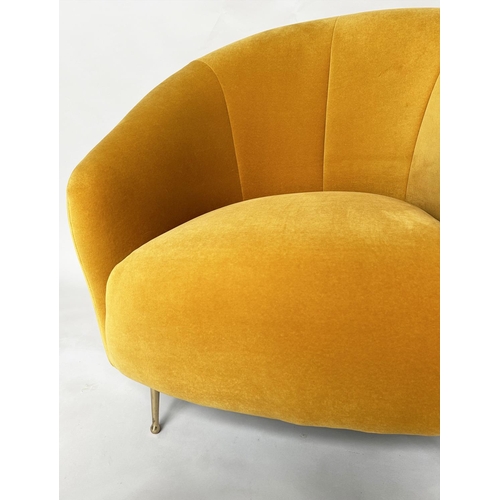 298 - HEAL'S ARMCHAIR, yellow velvet upholstered with curved back and tapering gilt metal supports, labell... 