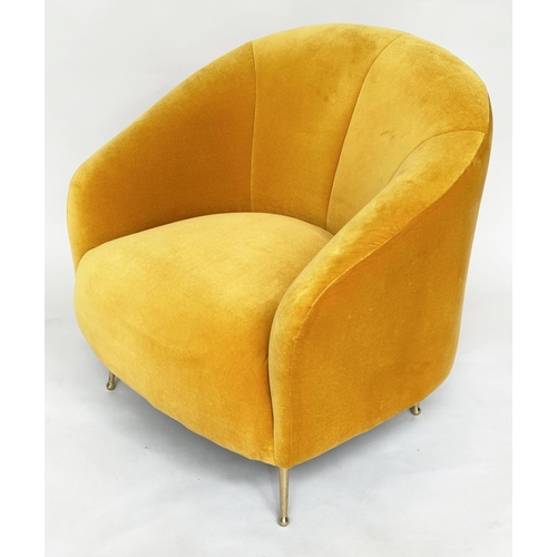 298 - HEAL'S ARMCHAIR, yellow velvet upholstered with curved back and tapering gilt metal supports, labell... 