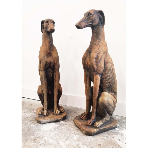 316 - SCULPTURAL DOGS, a pair, composite stone, 80cm H approx. (2)