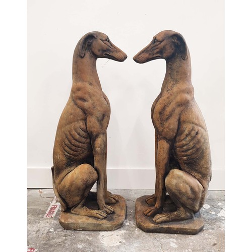 316 - SCULPTURAL DOGS, a pair, composite stone, 80cm H approx. (2)