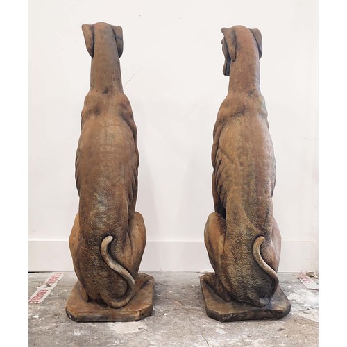 316 - SCULPTURAL DOGS, a pair, composite stone, 80cm H approx. (2)