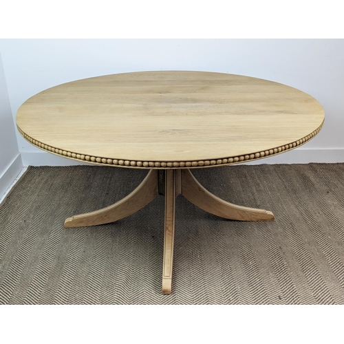 370 - BREAKFAST TABLE, oak circular top with carved detail to side on an outswept quadraform base, 150cm W... 