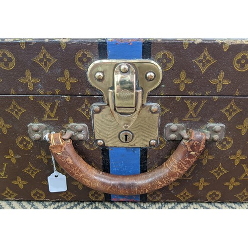 39 - LOUIS VUITTON VINTAGE HARD SUITCASE, monogrammed with leather handles and trims with decorative blue... 