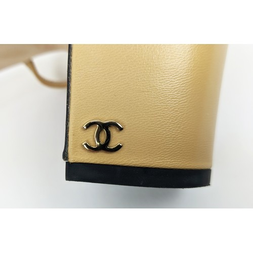 83 - CHANEL SLINGBACK SHOES, beige goatskin leather with black grosgrain toe, iconic CC logo in gold tone... 