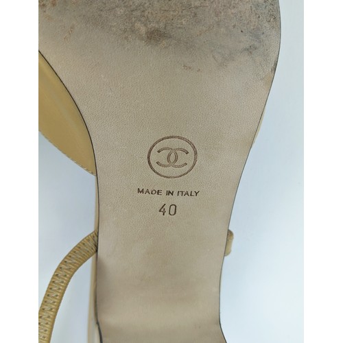 83 - CHANEL SLINGBACK SHOES, beige goatskin leather with black grosgrain toe, iconic CC logo in gold tone... 