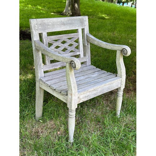 129 - COLONIAL STYLE GARDEN ARMCHAIRS, a pair, nicely weathered high grade teak each with pierced trellis ... 