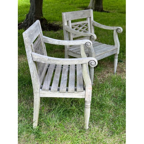 129 - COLONIAL STYLE GARDEN ARMCHAIRS, a pair, nicely weathered high grade teak each with pierced trellis ... 