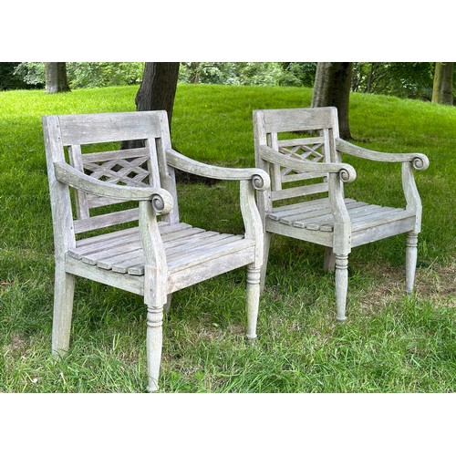 129 - COLONIAL STYLE GARDEN ARMCHAIRS, a pair, nicely weathered high grade teak each with pierced trellis ... 