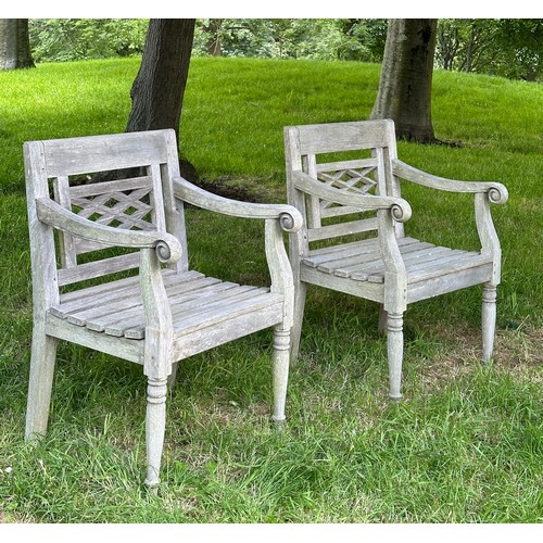 129 - COLONIAL STYLE GARDEN ARMCHAIRS, a pair, nicely weathered high grade teak each with pierced trellis ... 