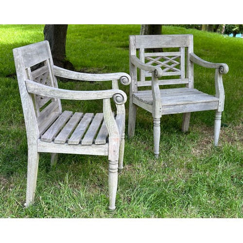 129 - COLONIAL STYLE GARDEN ARMCHAIRS, a pair, nicely weathered high grade teak each with pierced trellis ... 