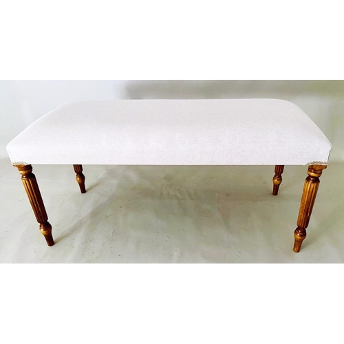 340 - FOOTSTOOL, neutral linen upholstery on reeded supports, 48cm H x 98cm L x 40cm W