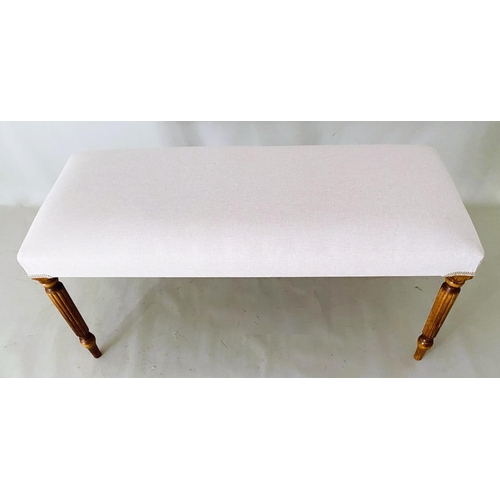 340 - FOOTSTOOL, neutral linen upholstery on reeded supports, 48cm H x 98cm L x 40cm W