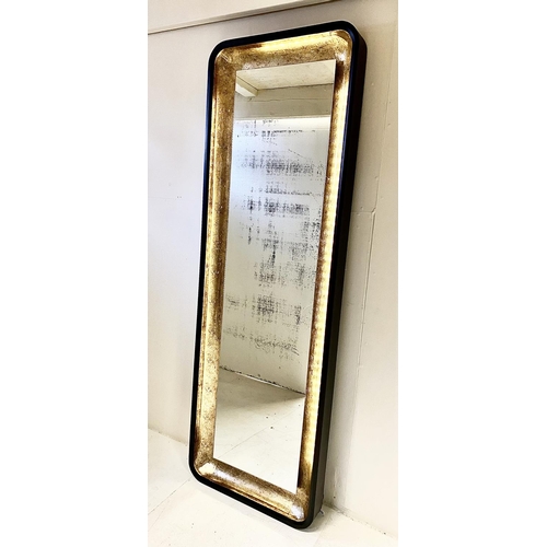 351 - WALL MIRROR, black and gilt frame with light to detail, 180cm H x 60cm W.