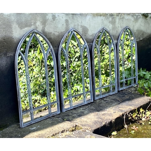 352 - ARCHITECTURAL GARDEN MIRRORS, a set of four, arched metal frames, 60cm H x 38cm W. (4)